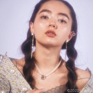 Liquem / Star long clip on earrings