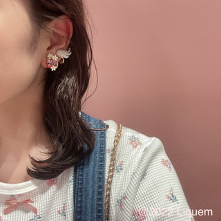 Liquem / Ceramic style little Nike clip on earrings