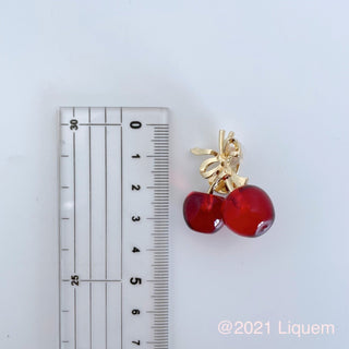 Liquem/Ribbon cherry clip on earrings (clear red)