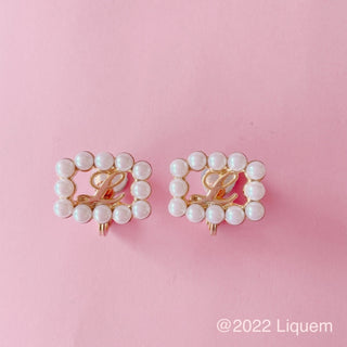 Liquem / L clip on earrings