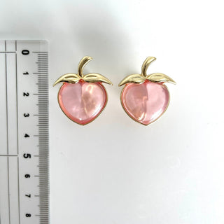 Liquem / Juicy peach clip on earrings (powder glitter)