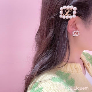 Liquem / L clip on earrings